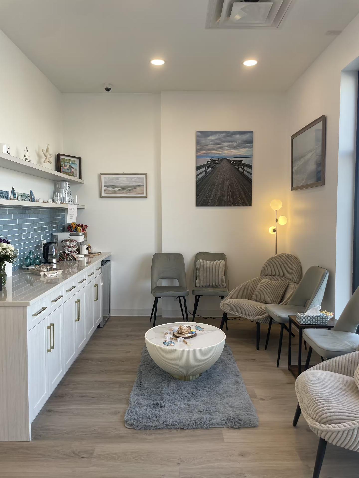 Calm waiting lounge with coastal artwork